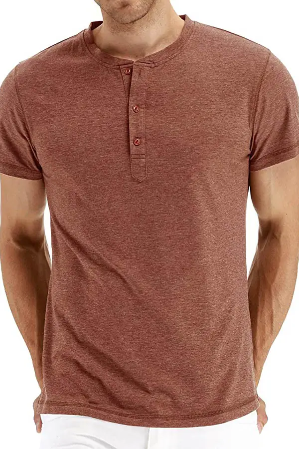 Close up of model wearing rust-colored henley t-shirt. 
